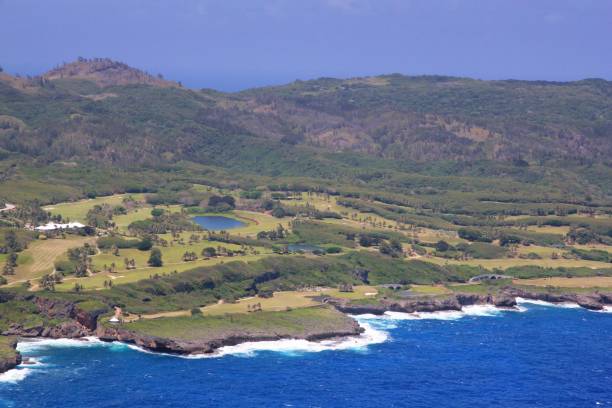 istock Blue and green golf courses and mountain view, Saipan 690205632