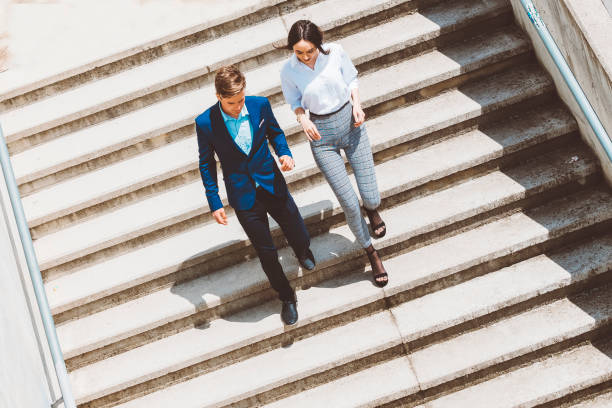 istock High angle view of Two businesspeople outdoors on staircase 690209868