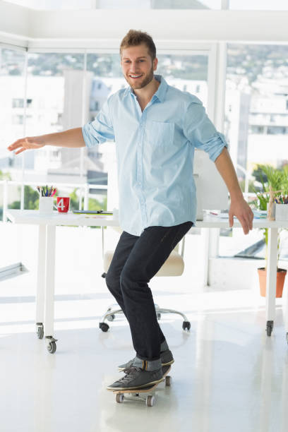 istock Designer skateboarding smiling at the camera 690210874