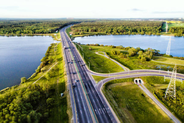 istock Green forest and asphalt road from above 690214276