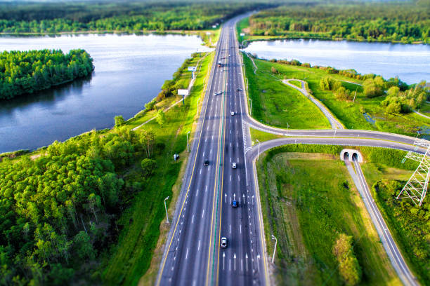 istock Green forest and asphalt road from above 690214310