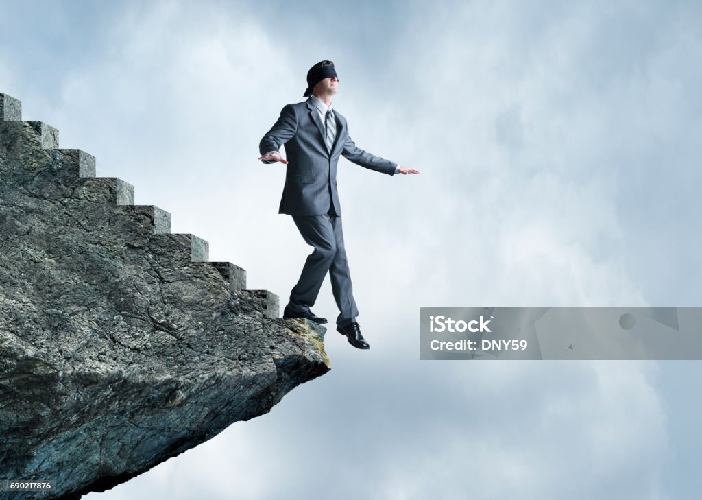 Blindfolded man running off a cliff, conceptual image - Stock Image -  F034/1697 - Science Photo Library