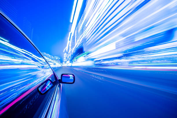 istock View from Side of Car moving in a night city 690218422