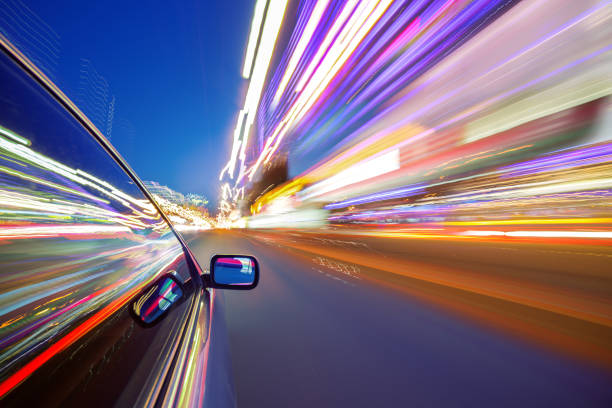 istock View from Side of Car moving in a night city 690218714