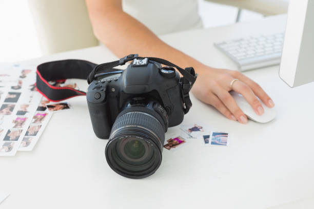 istock Digital camera on photographers desk 690219004