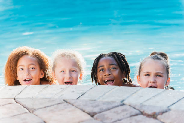 istock Multi-ethnic group of children in swimming pool 690223504