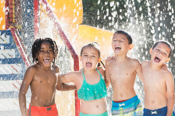 istock Multi-ethnic children at a water park 690223568