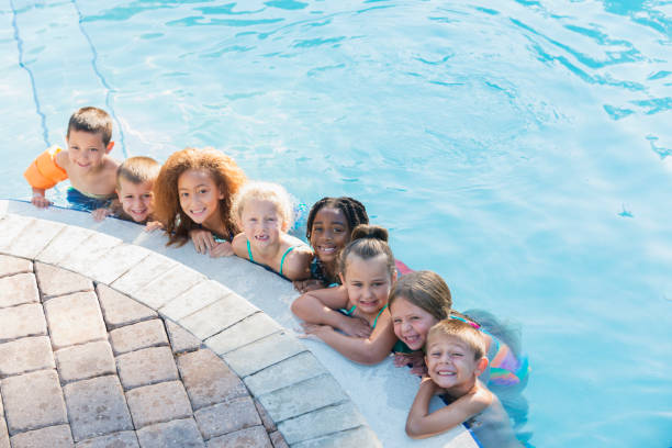 istock Multi-ethnic group of children in swimming pool 690223624