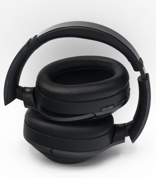 istock Black plastic wireless bluetooth over the ear headphones 690224618