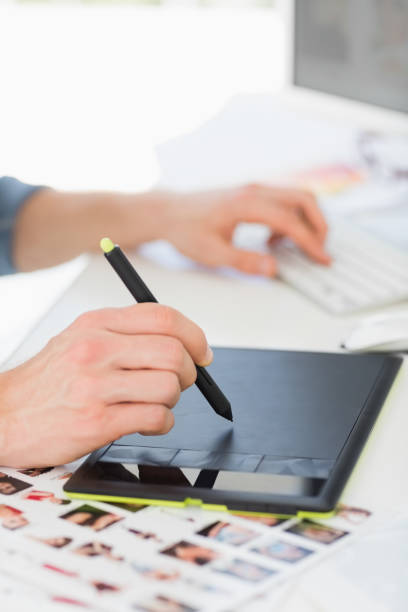 istock Designer working with digitizer and stylus at his desk 690224854