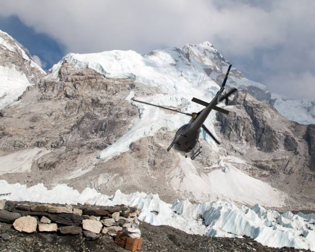 istock helicopper in Mount Everest base camp and mount Nuptse 690227246