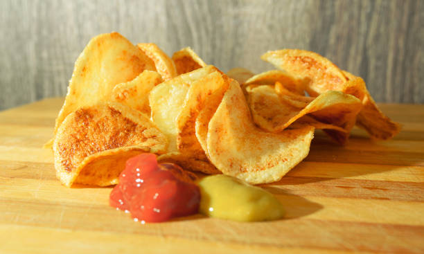 istock Portion of fried rounded potato with ketchup and mustard 690227622