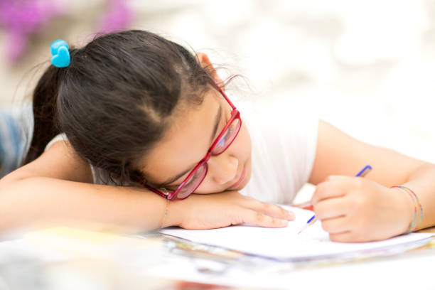 istock Little hispanic Girl Studying 690227858