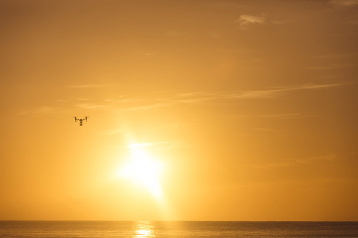 A beautiful evening as the sun sets on the ocean horizon