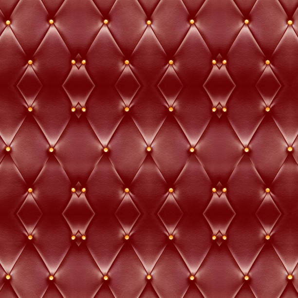 istock Texture of beautiful deep red leather sofa with golden buttons use for background. 690229558