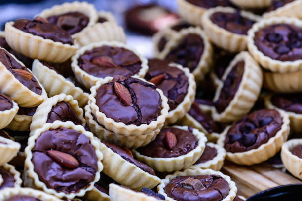 istock Cookies dark chocolate cup shaped with almond. 690229842