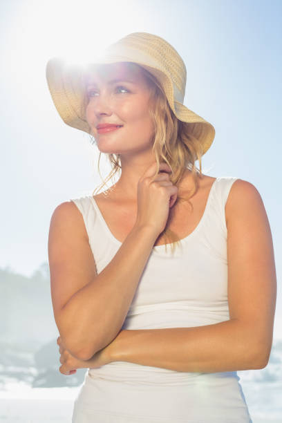 Gorgeous happy blonde posing at the beach on a sunny day