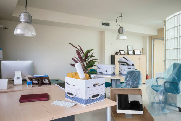 istock Belongings in box on table in office 690240420