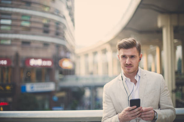 istock Gentleman listening music 690243220