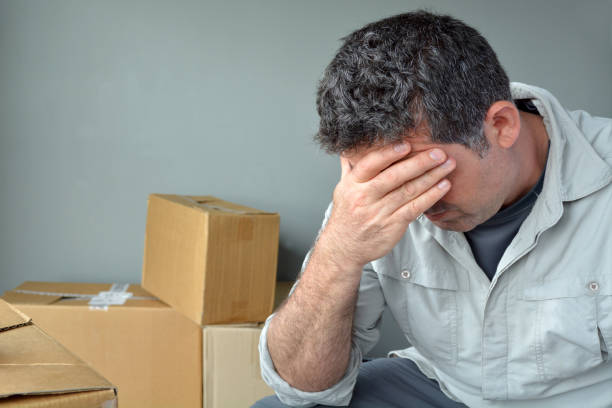 istock Sad evicted man worried relocating house 690243620