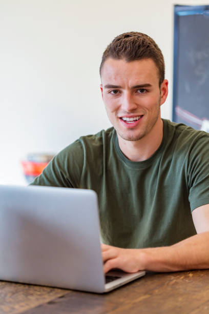 istock Portrait of a Young Business Man With Computer 690254394