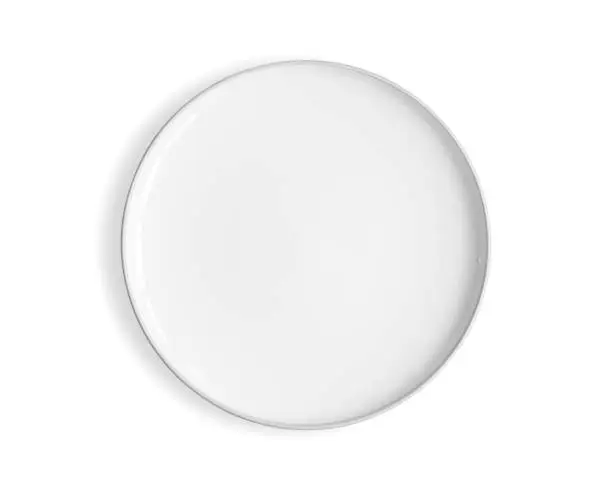 Top view of empty white food plate isolated on a white background.