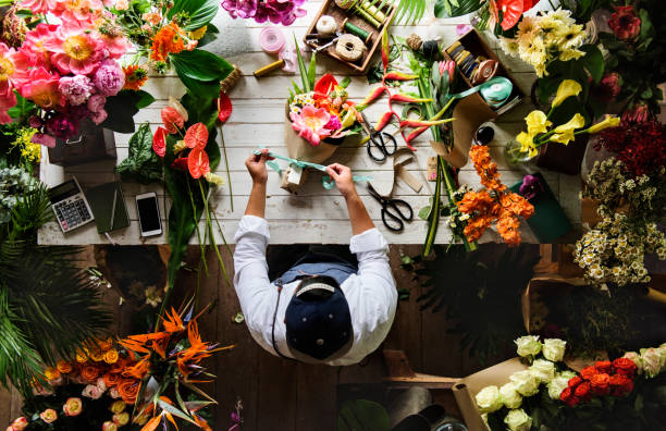 istock Flower shop business owner working service 690258738