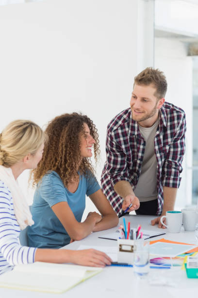 istock Young happy design team having a meeting together 690259798