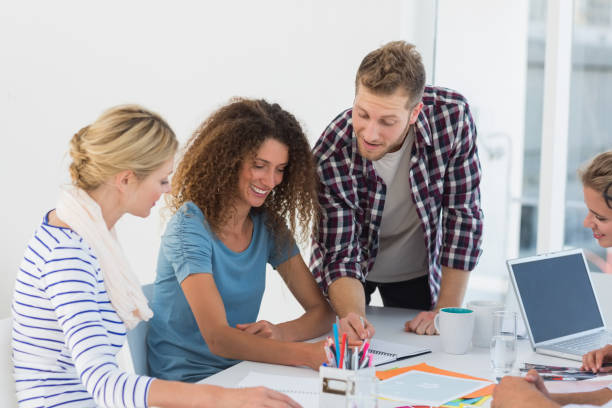 istock Young happy design team brainstorming together 690259800