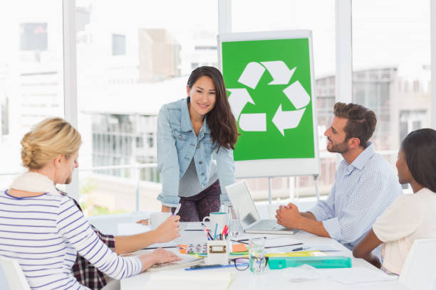 istock Smiling team having a meeting about recycling policy 690260028