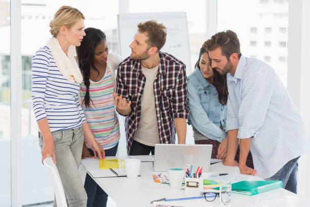 istock Focused team of designers having a meeting 690260114