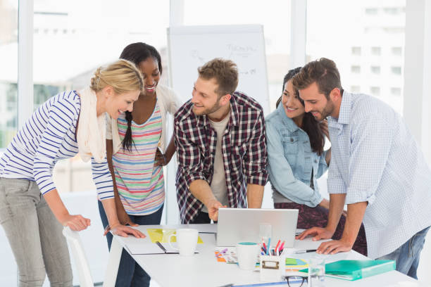istock Smiling team of designers having a meeting 690260118