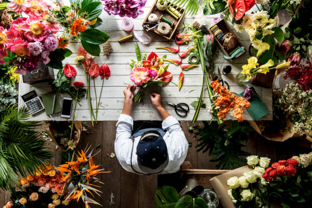 istock Florist arrange a flower for a bouquet 690262626