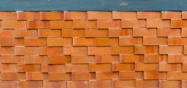 Brown brick fence with modern pattern