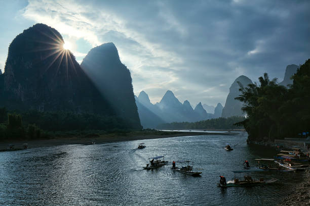 istock Sunset at busy Li River, Guilin, China 690265272