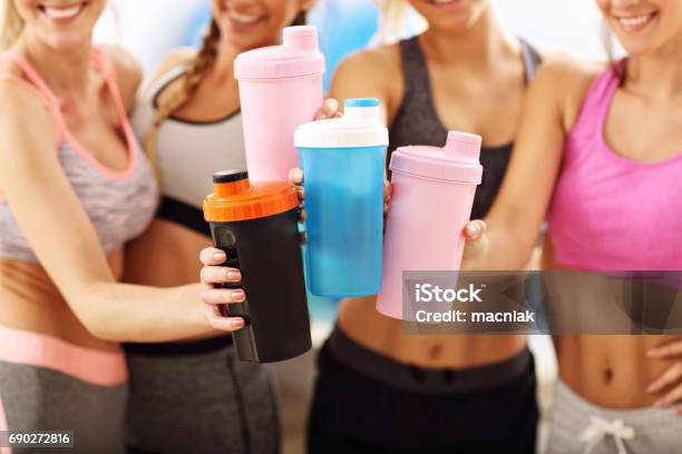 Young Women Group Resting At The Gym After Workout Stock Photo - Download Image Now - Protein Drink, Cocktail Shaker, Women