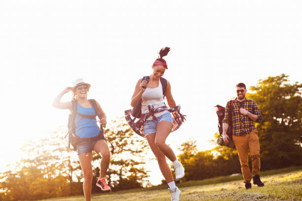 istock Group of friends running free 690280726