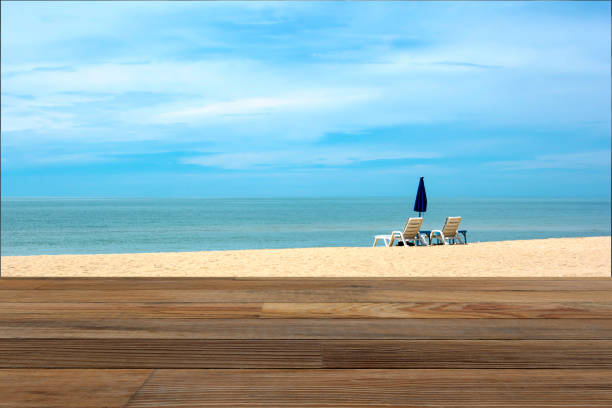 istock Wood table and the beach in background. 690281034