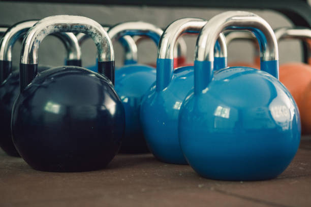 istock Colorful kettle bells in gym 690281394