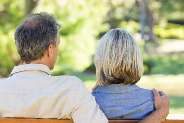 istock Couple relaxing in park 690287750
