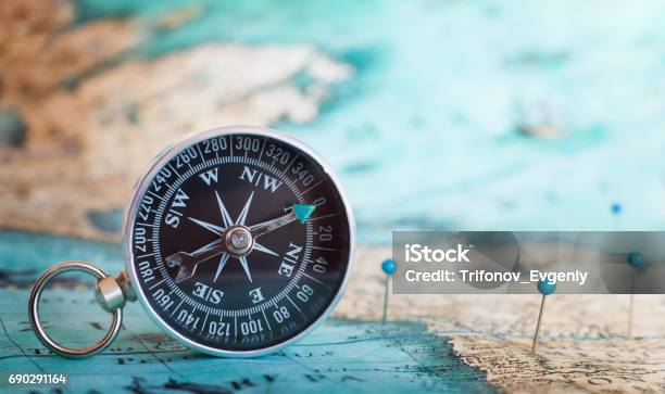 Compass On The Map Stock Photo - Download Image Now - Navigational Compass, Map, Journey