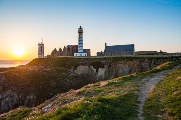 istock Abbey ruin and lighthouse, Pointe de Saint-Mathieu, Brittany, France 690299028