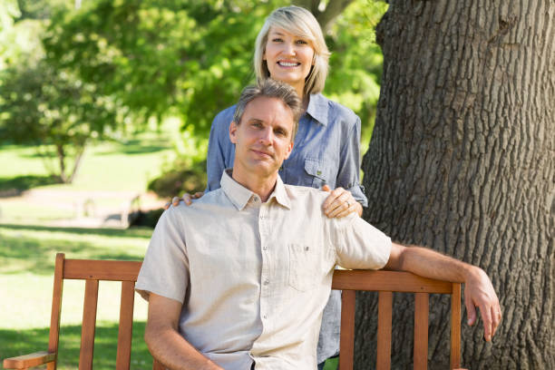 istock Couple relaxing in park 690302726