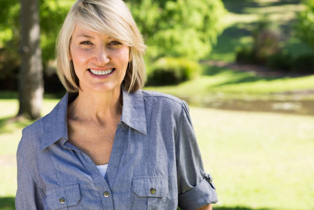 istock Beautiful woman in park 690302916