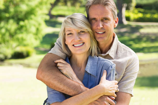 istock Man embracing woman from behind 690302998