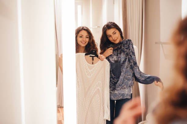 istock Two friends in a dressing room 690303256