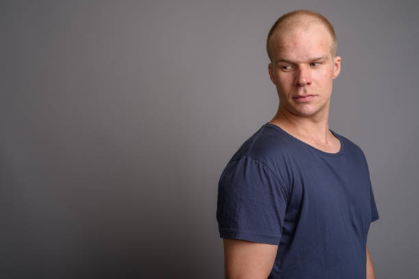 istock Studio shot of bald man against gray background 690303356