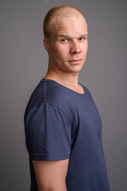 istock Studio shot of bald man against gray background 690303364