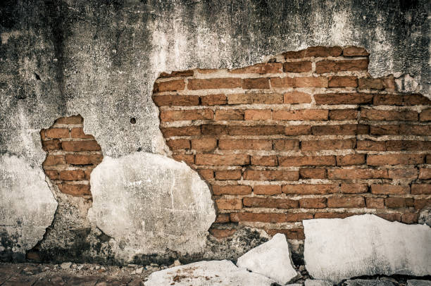 istock cracked concrete vintage brick wall background, old dirty 690304058