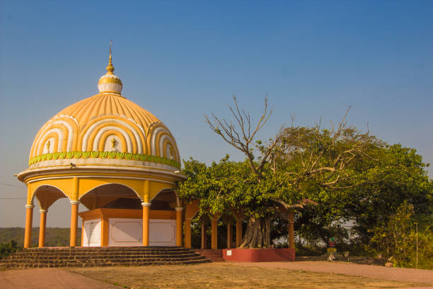 istock Temple in Goa, Arambol, India. Yellow small temple 690304316